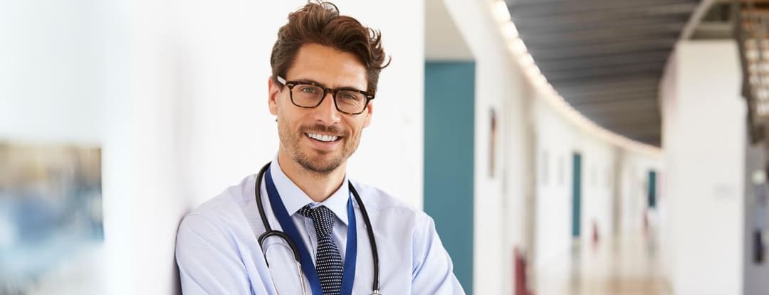 Male PCP doctor smiling